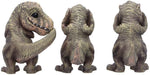 Drei weise T-Rex Figuren: Nichts sehen, nichts hören, nichts sagen
